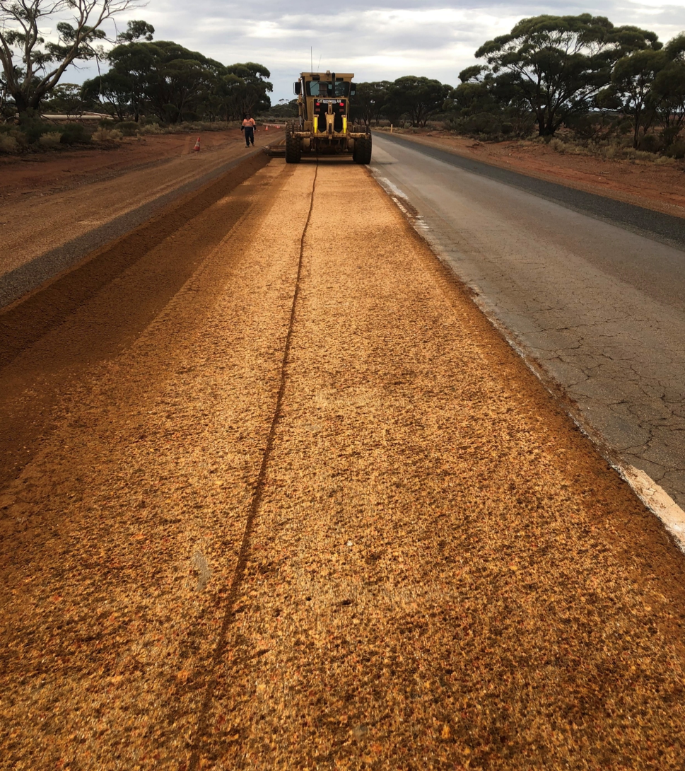 Caterpillar grader carrying out road widening and pavement rehabilitation on a rural Western Australian road